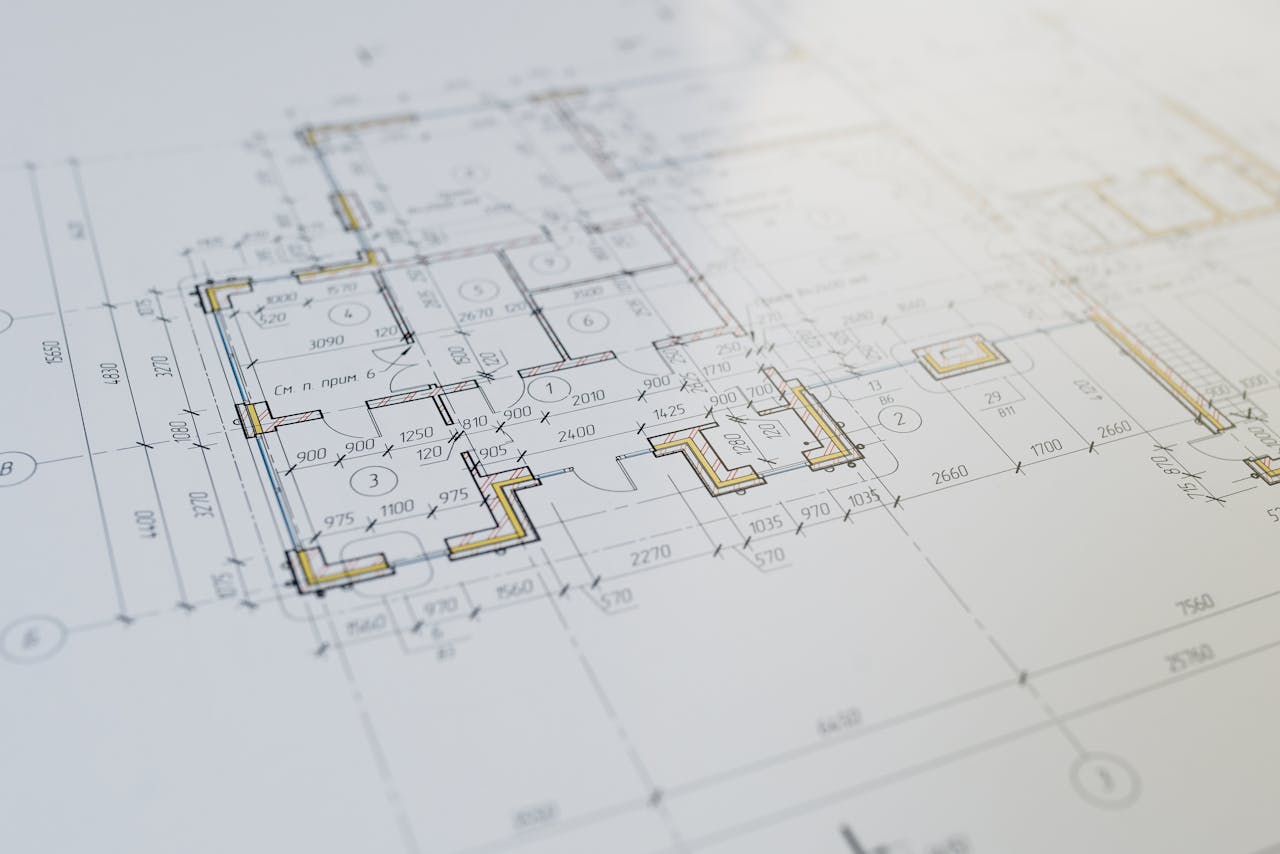 Engineers reviewing NEC3 contract drawings